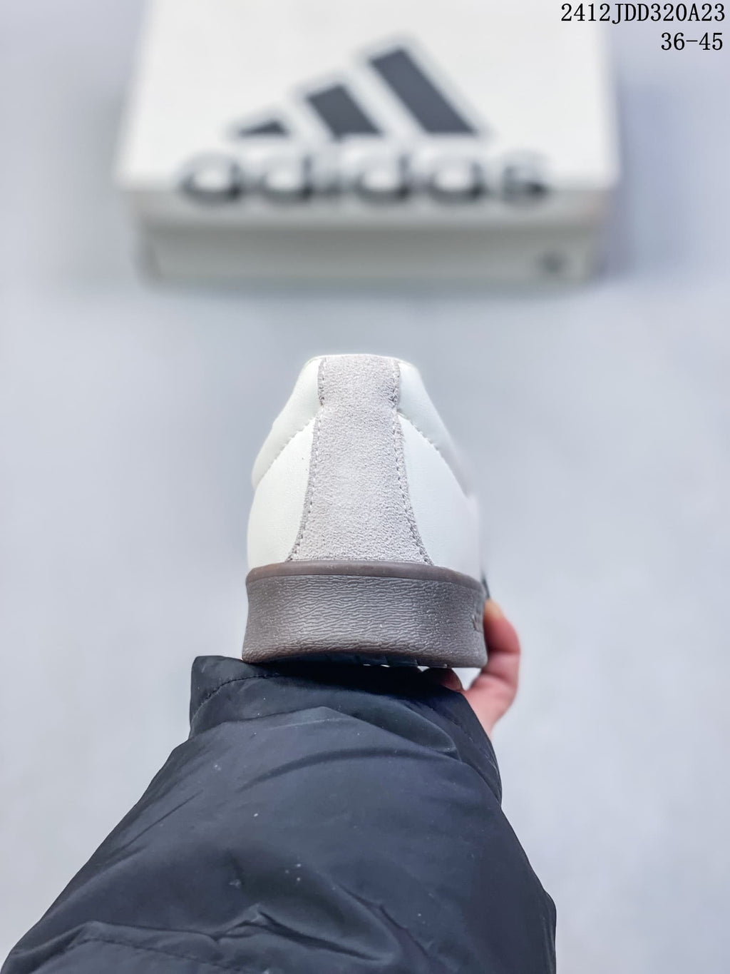 Rear view highlighting the gray heel panel and dark brown outsole.