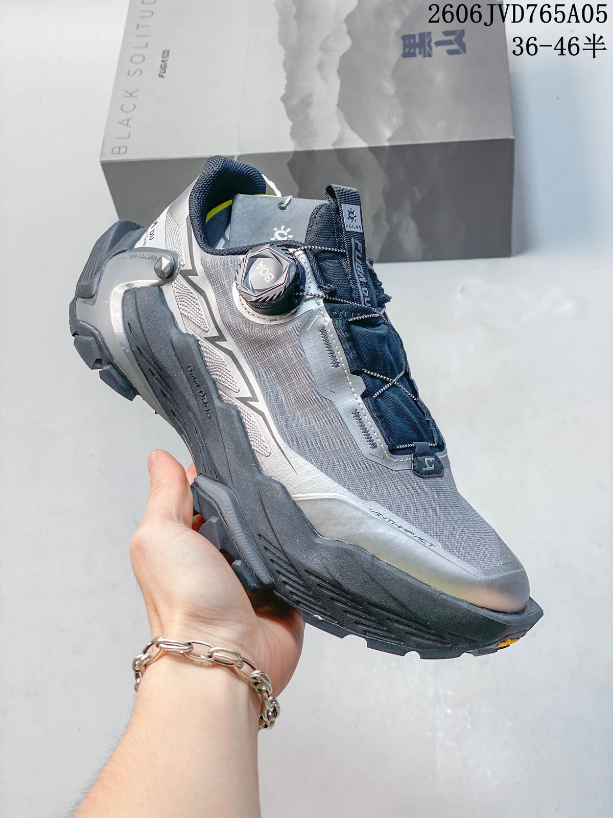 Angled side view showing the shoe’s BOA dial, mesh upper, and rugged outsole.
