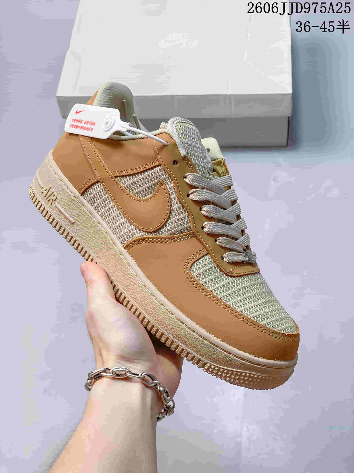 Side view of a tan and cream low-top sneaker with woven-look panels