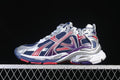 Side view of a navy, red, purple, silver and white Balenciaga Runner sneaker