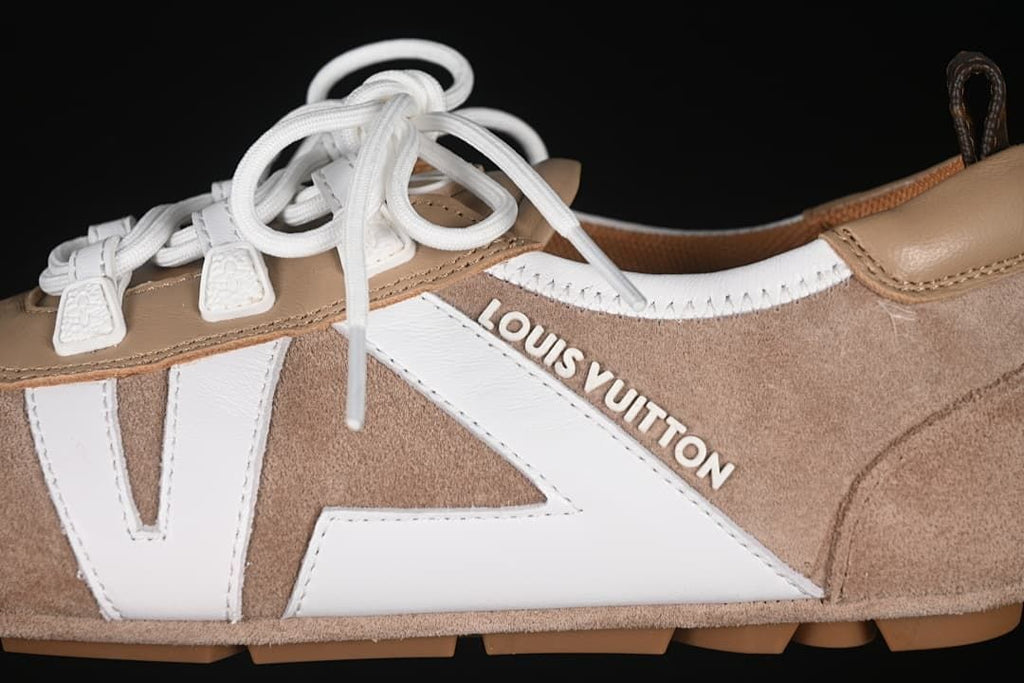 Side detail showing white panels, lace supports, and Louis Vuitton lettering