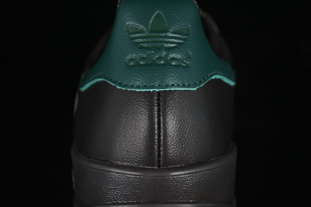 Rear view of the sneaker showing the teal-green heel tab