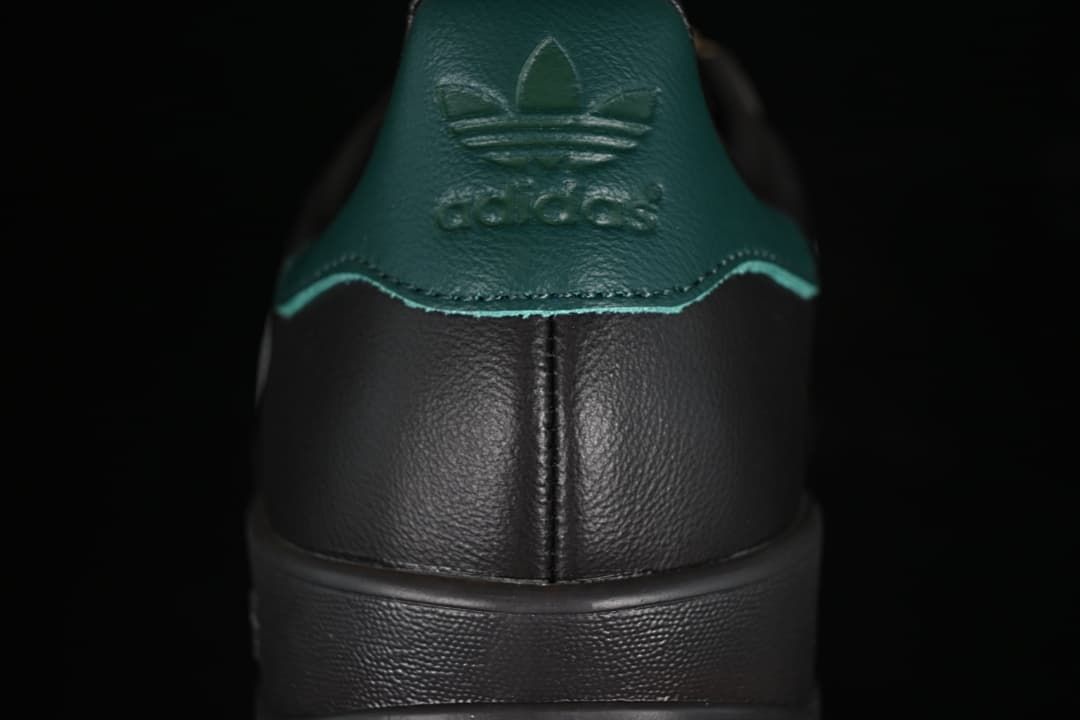 Rear view of the sneaker showing the teal-green heel tab