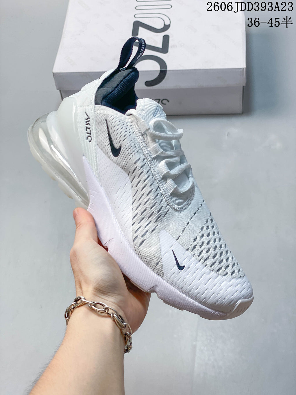 Angled side view of a white Nike Air Max 270 sneaker