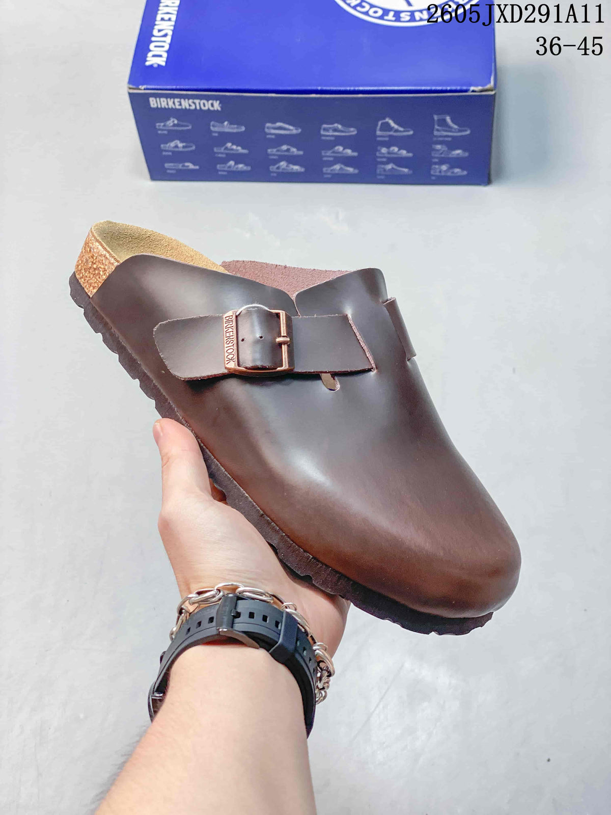 Dark brown smooth-looking Zurich-style clog sandal with an adjustable buckle strap