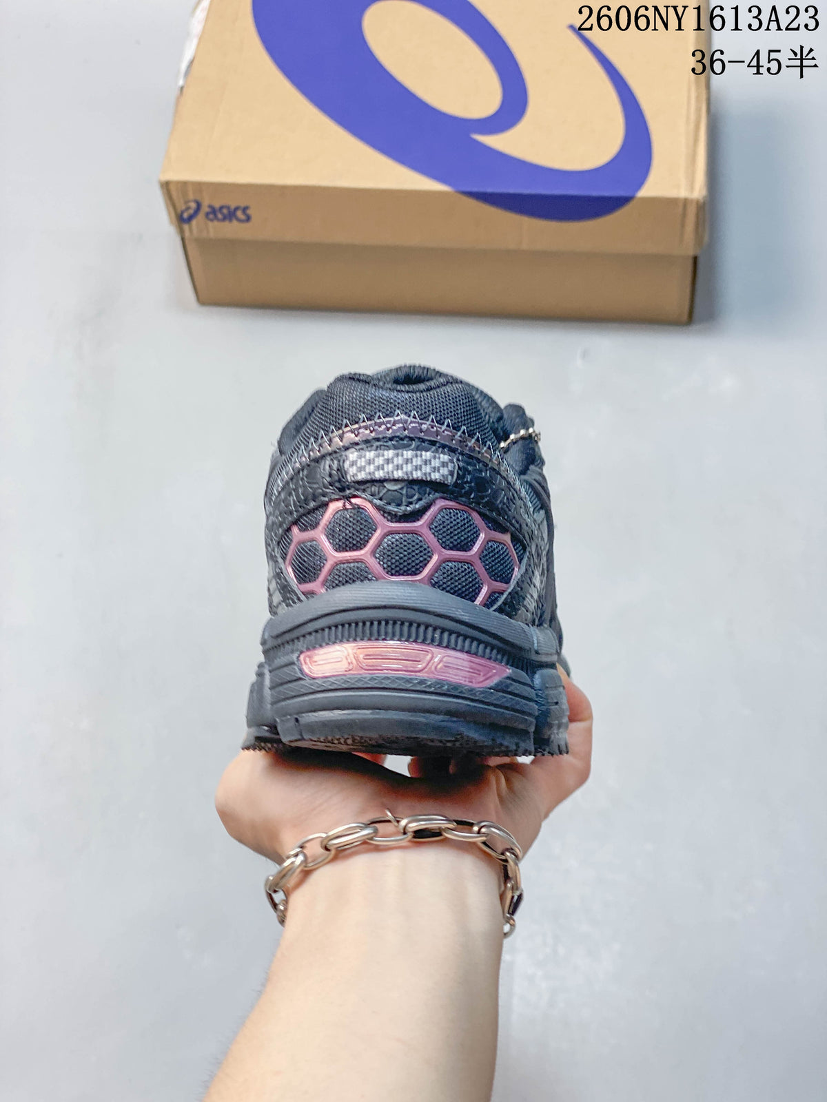 Rear view of the ASICS Gel-Kahana 8 FL showing pink heel accents