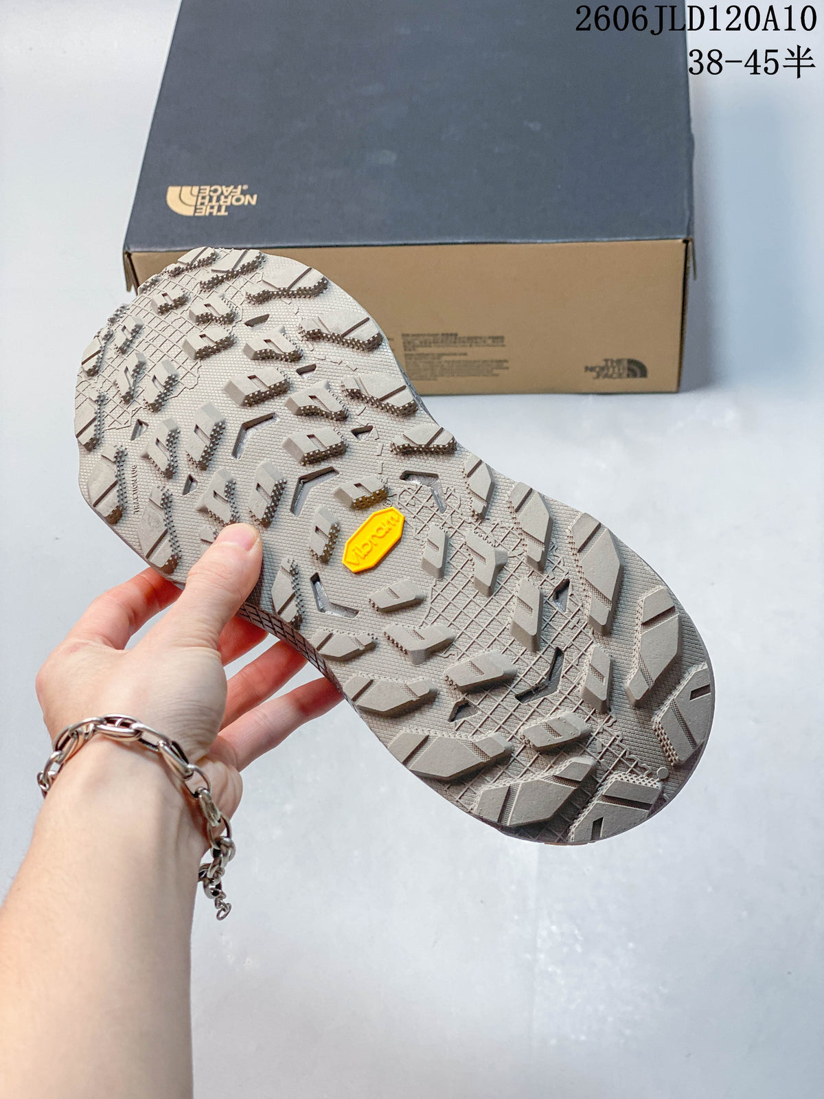 Close-up of the lugged outsole with a Vibram logo