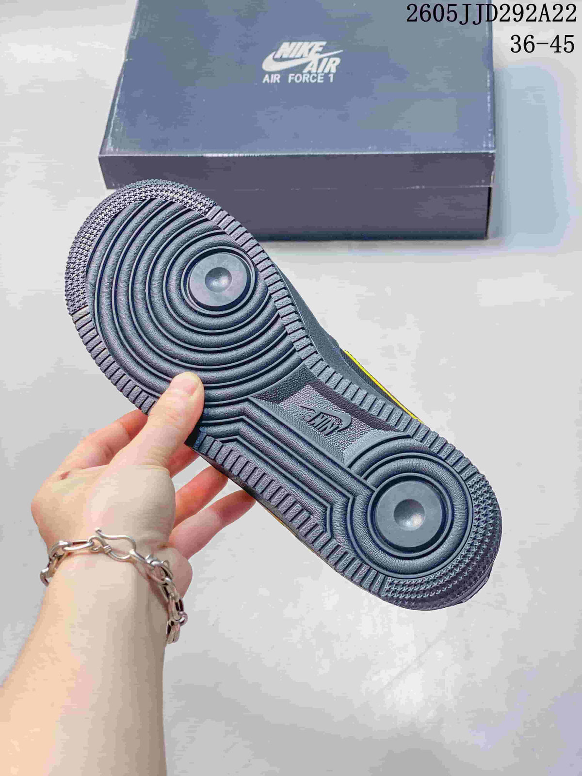 Close-up of the gray sneaker outsole with circular traction pattern