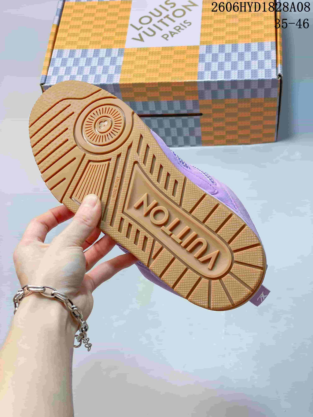 Close-up of the sneaker's gum-colored outsole with patterned tread