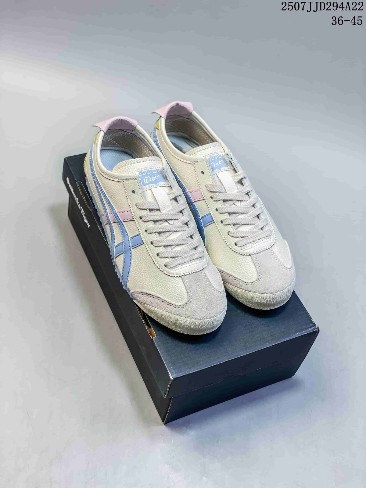 Pair of cream Onitsuka Tiger Mexico 66 Deluxe sneakers with blue stripes and pastel accents on a shoebox