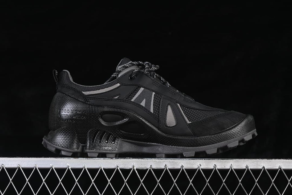 Side profile showing grey accents and trail-style sole