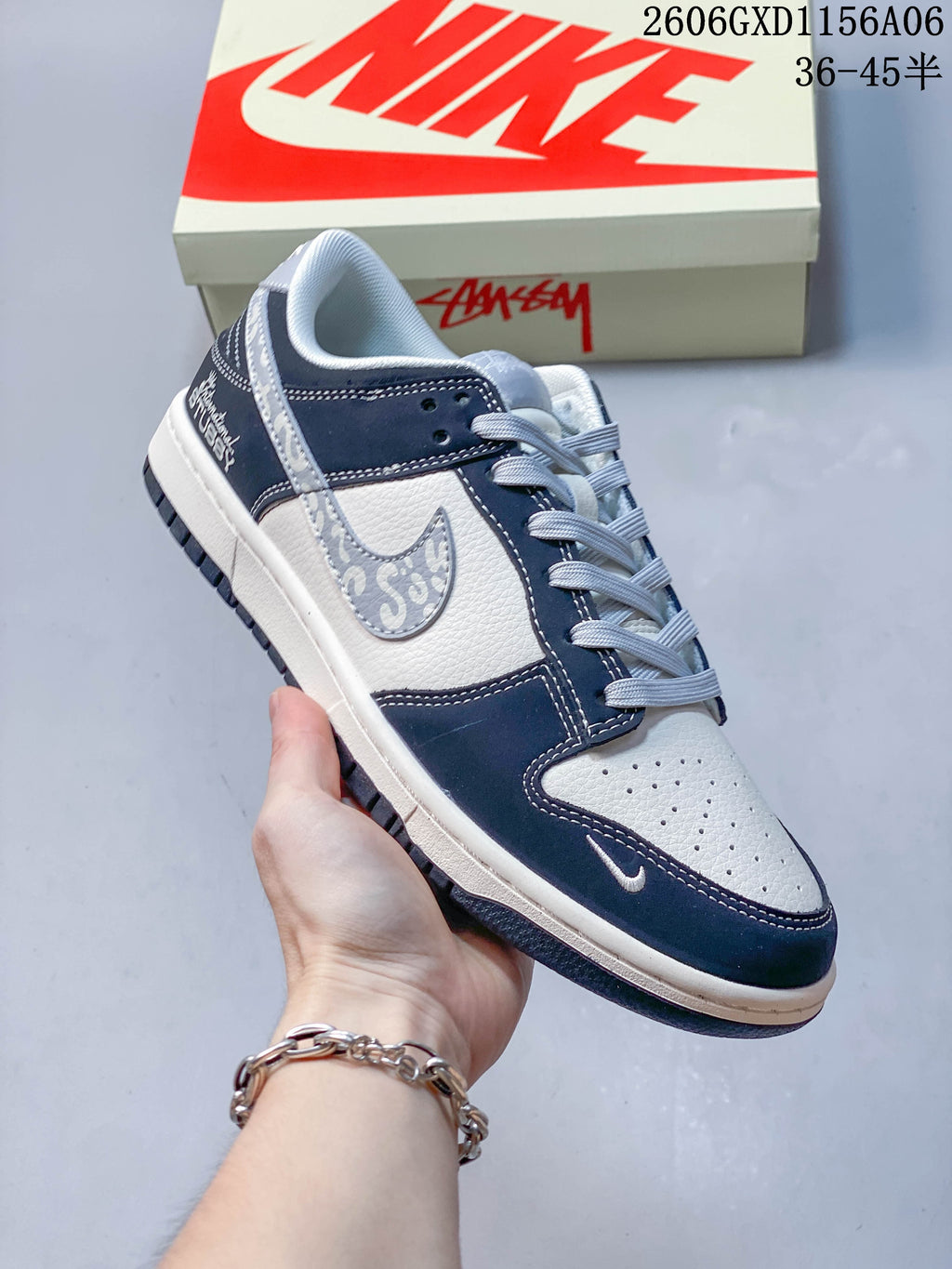 Angled view of the low-top sneaker with patterned side accent and embroidered heel branding.