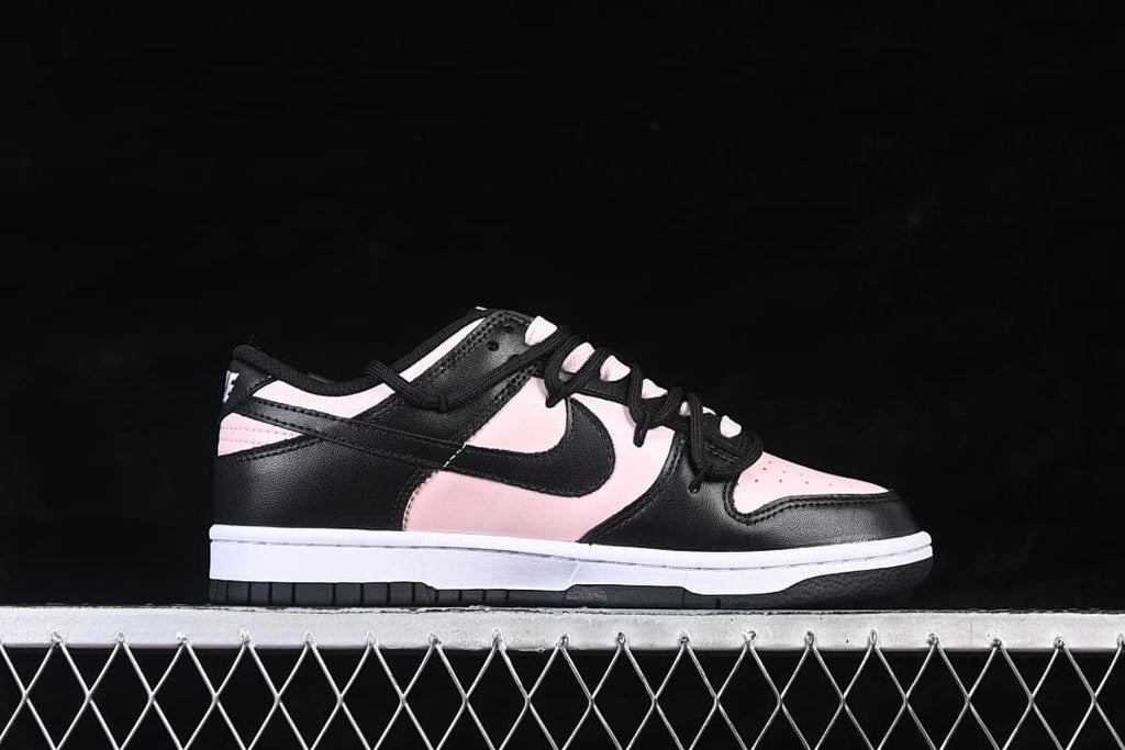 Side profile of the black and pale pink low-top sneaker