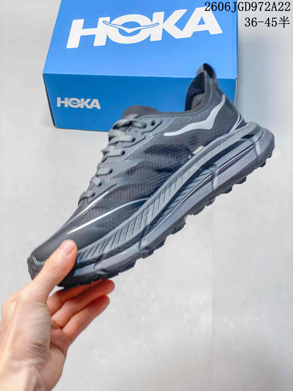 Side profile of a charcoal-gray HOKA Mafate Speed 4 Lite shoe