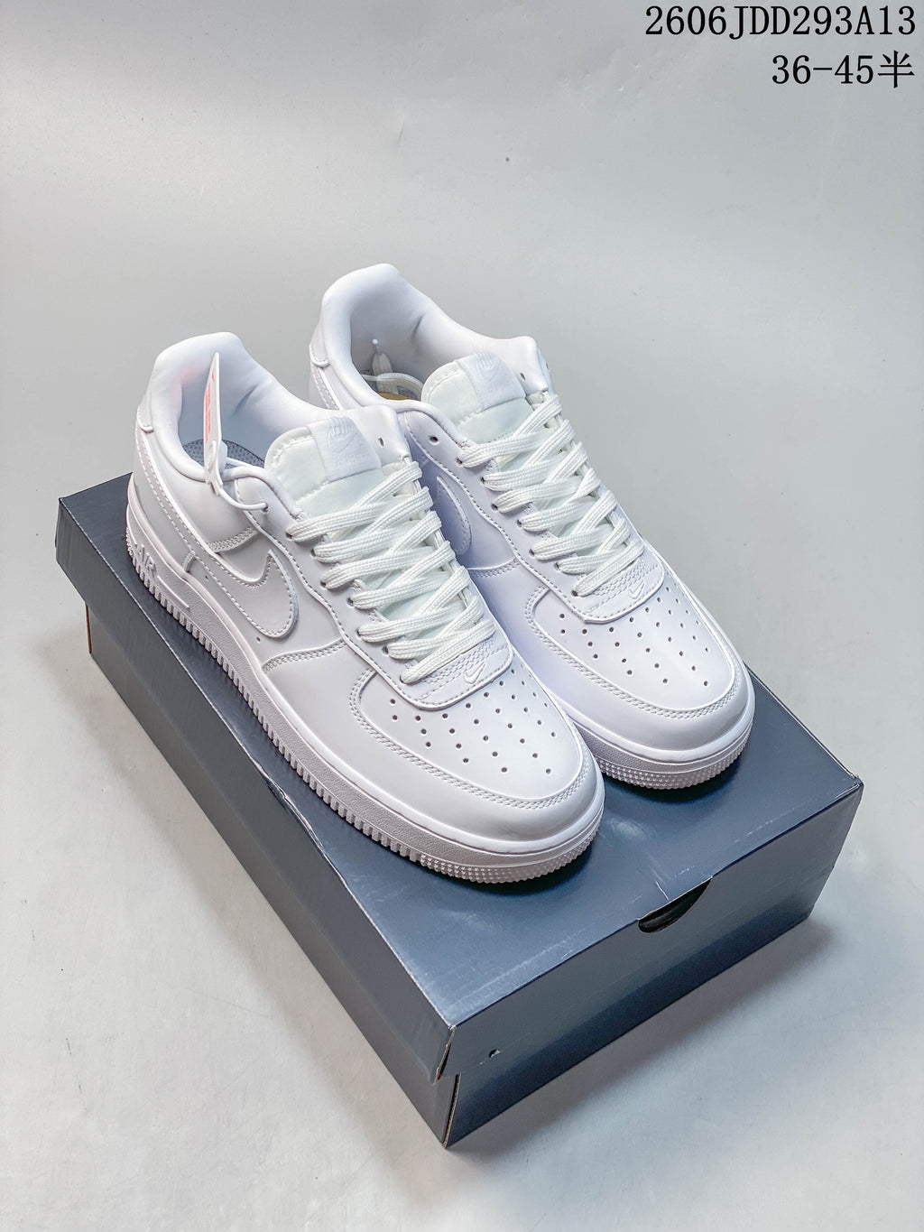 White low-top Nike Air Force 1-style sneakers on a shoebox; image overlay shows size range 36–45.5.
