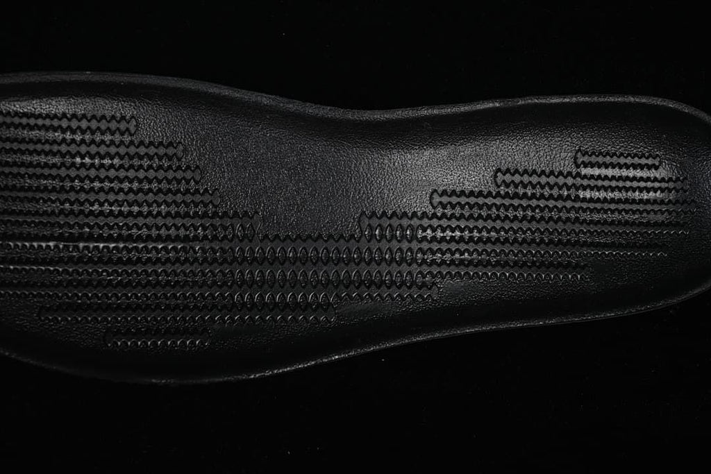 Close-up of the black patterned outsole