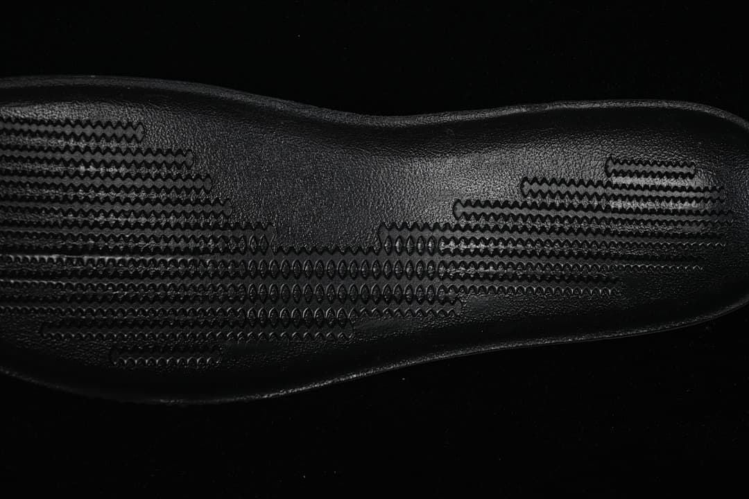 Close-up of the black patterned outsole