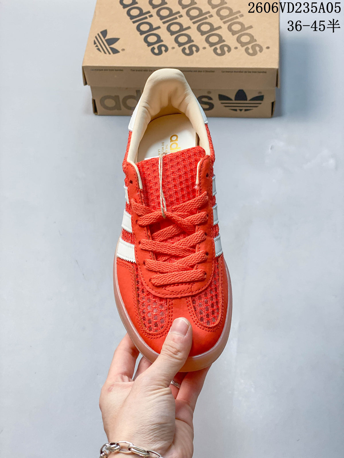 Front view of the red lace-up sneaker