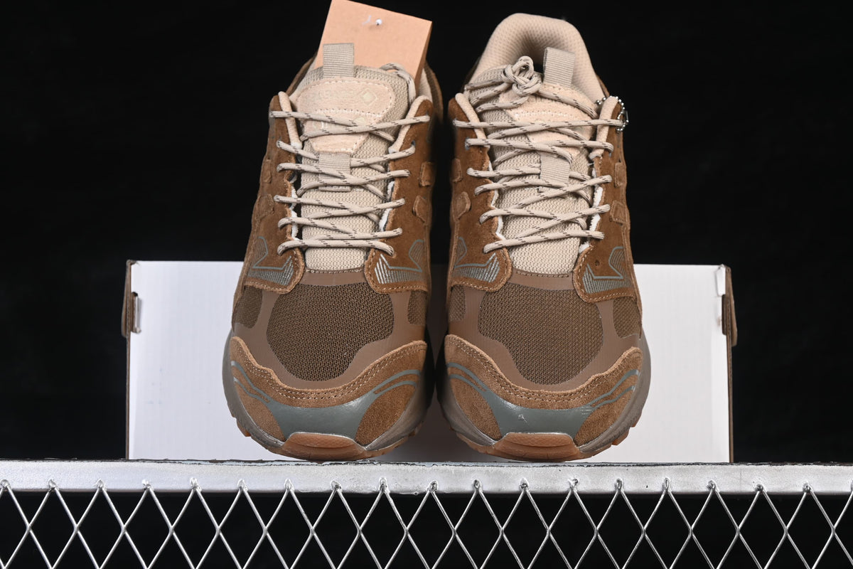 Front view of both sneakers positioned on the shoebox.