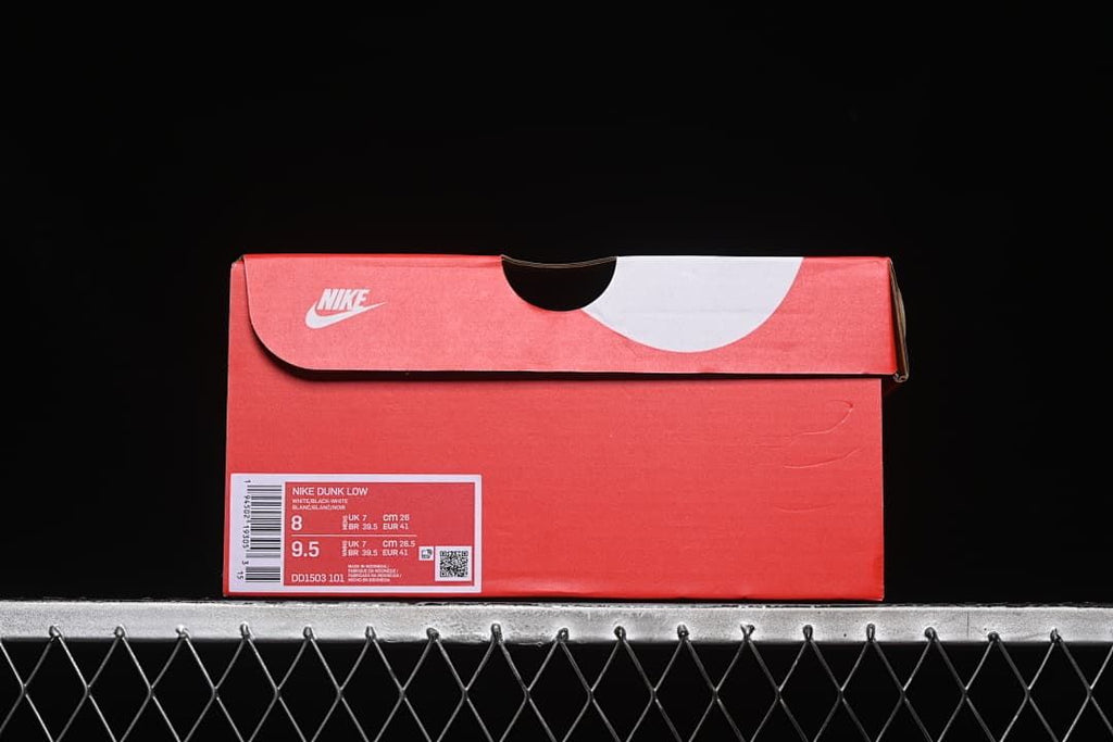 Red sneaker box with a visible Nike Dunk Low product label