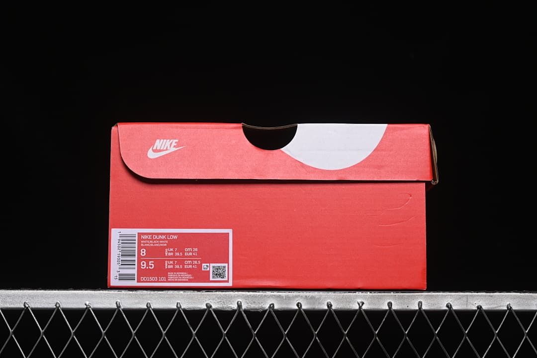 Red sneaker box with a visible Nike Dunk Low product label