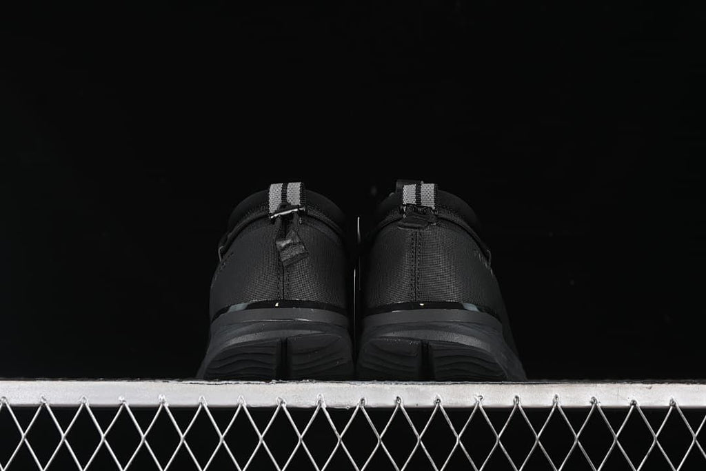 Rear view of both sneakers showing heel tabs and outsoles