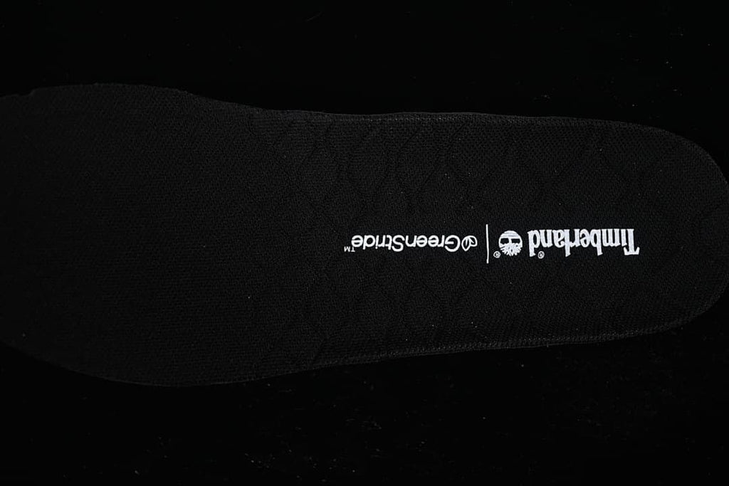 Close-up of the black footbed printed with Timberland GreenStride branding