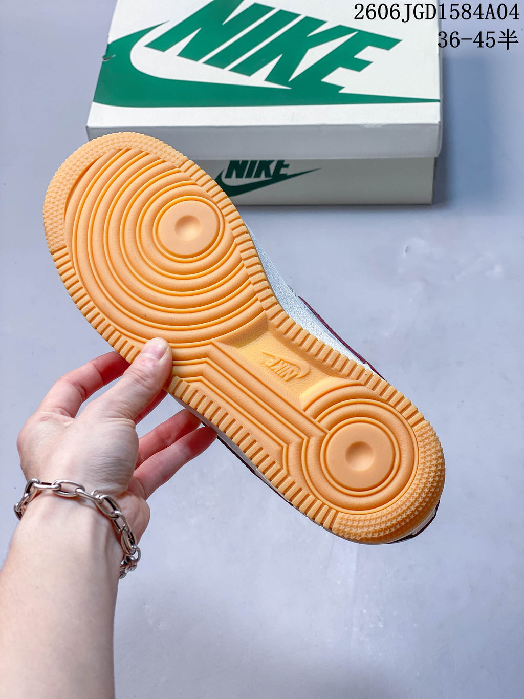 Close-up of the gum-colored outsole with a circular tread pattern