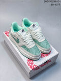 Pair of white and mint-green Nike Court Vision Low sneakers with snake-scale patterned panels on a Year of the Snake 2025 box