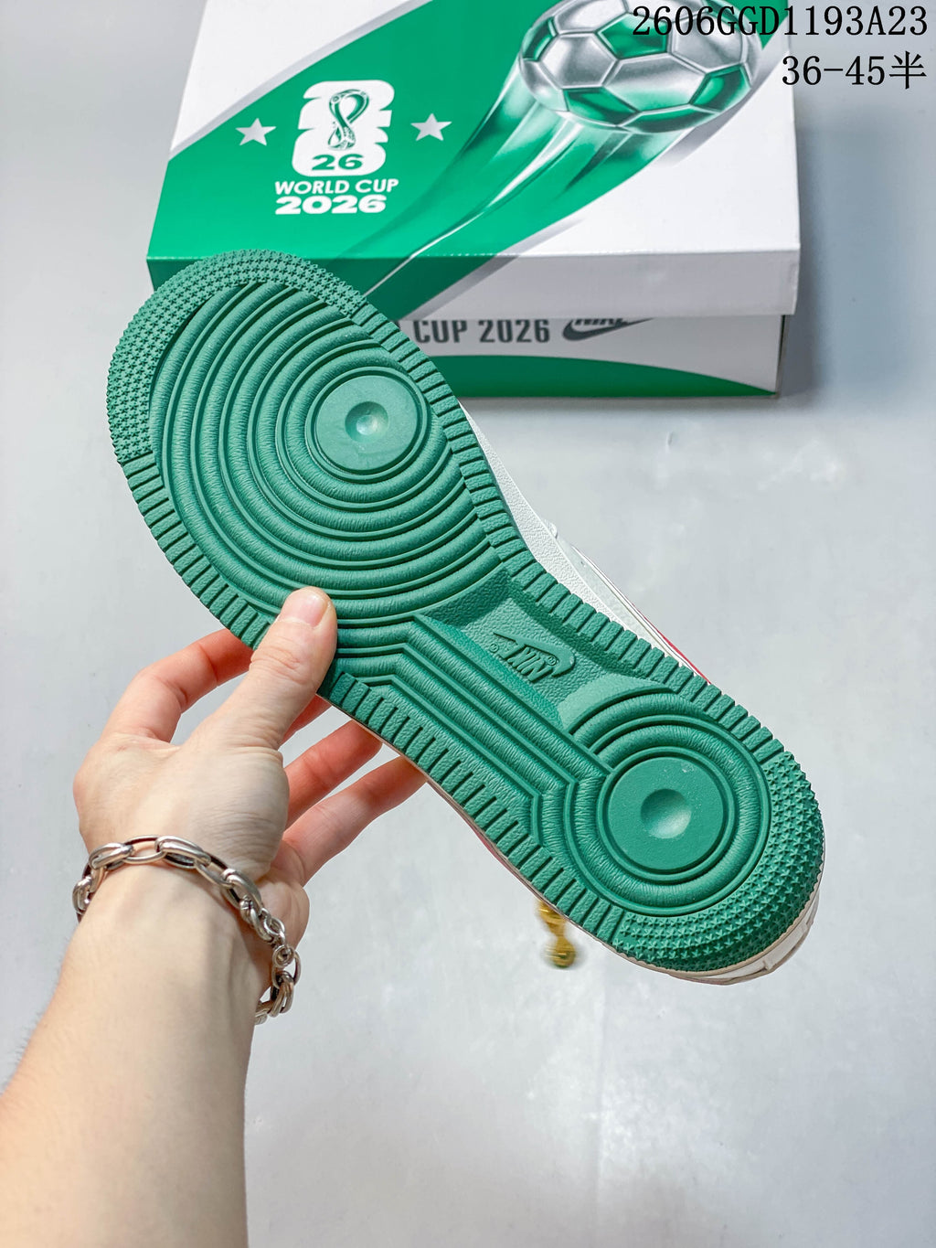 Green outsole shown with the football-themed shoebox