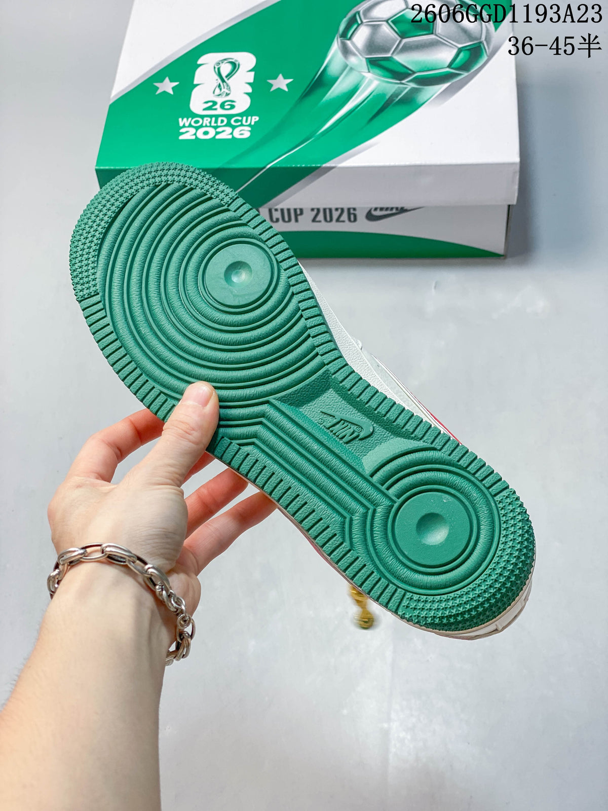 Green outsole shown with the football-themed shoebox