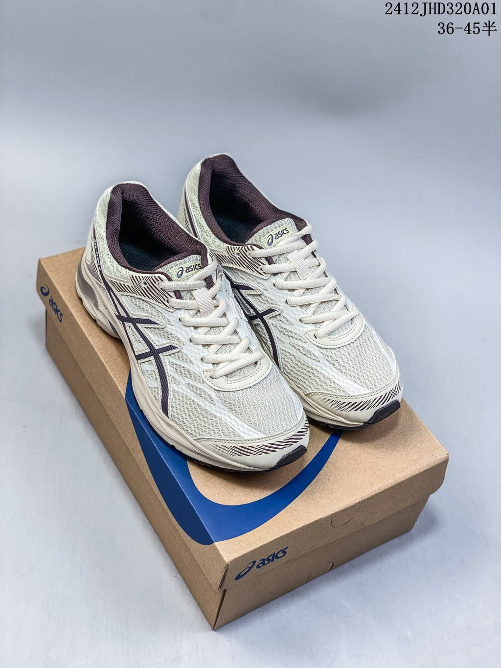 Pair of cream ASICS GEL-KAHANA 8 trail running shoes on a shoebox