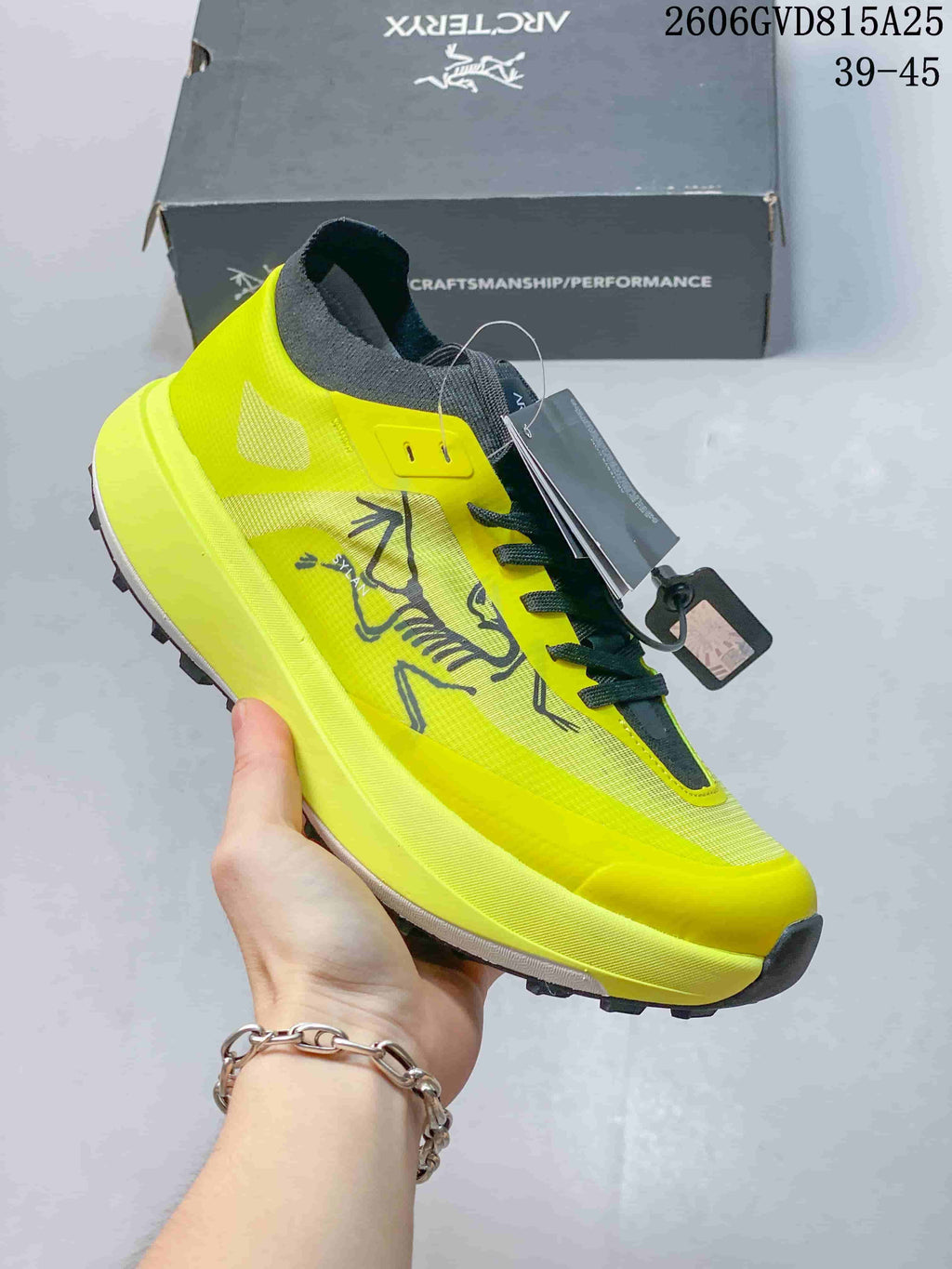 Side view of a bright yellow Arc'teryx KNORVAN SY shoe.