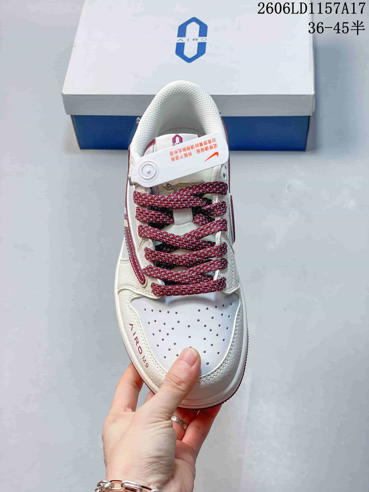 Top view showing perforated toe panel and patterned burgundy laces