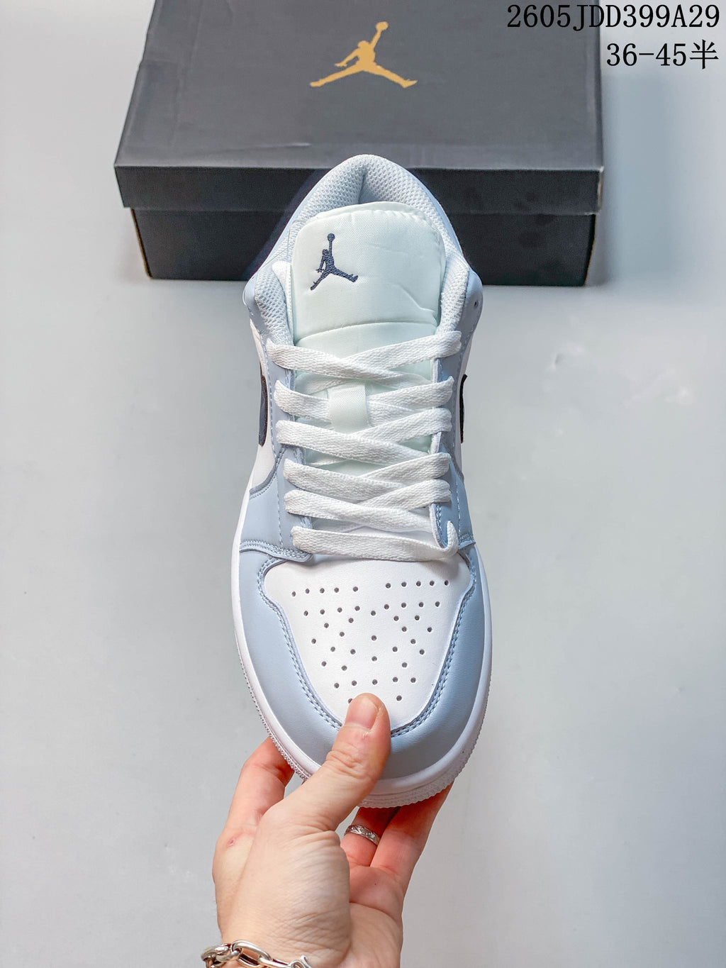 Top view showing white laces and perforated toe panels