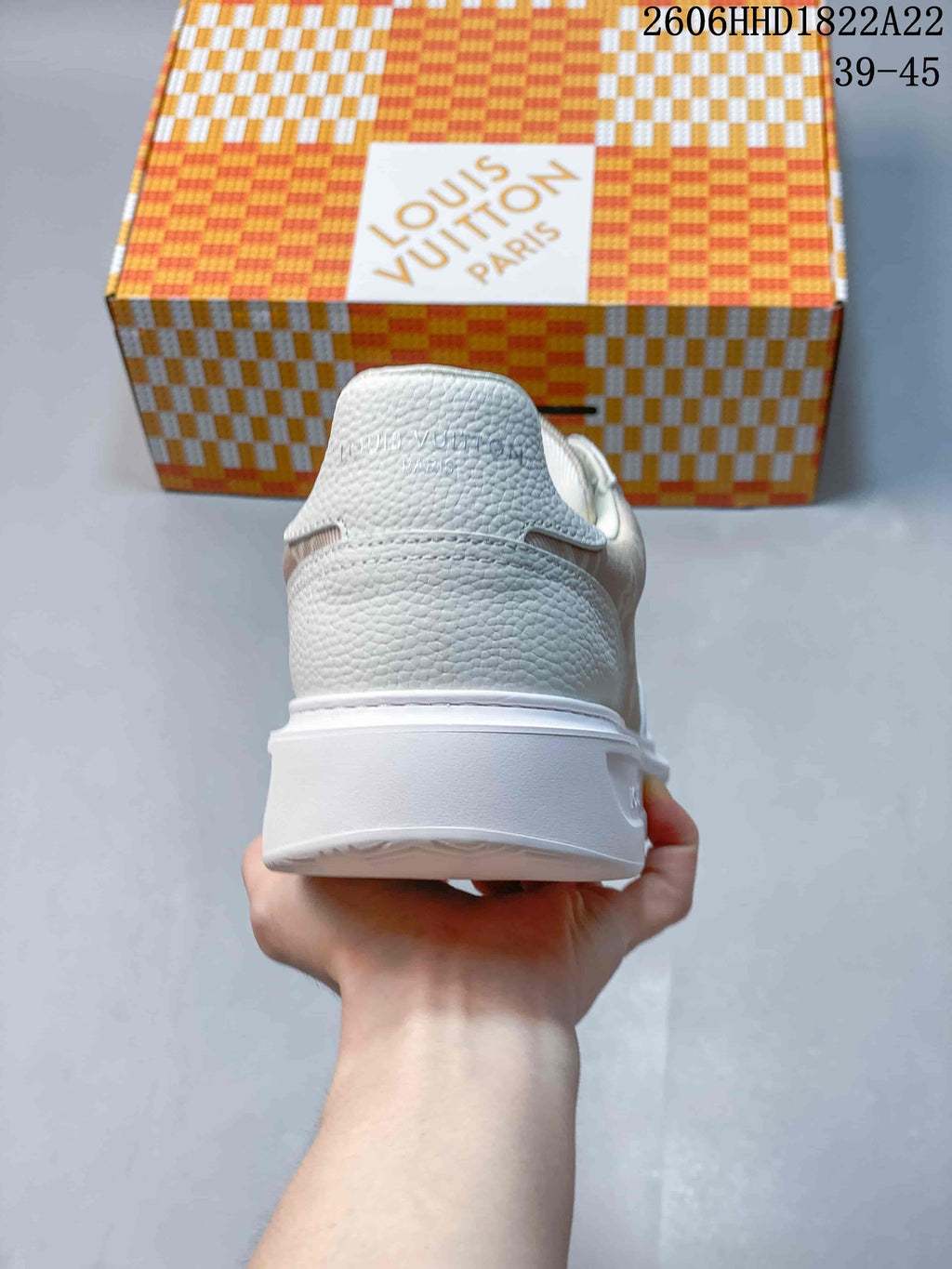 Rear view of the sneaker showing the heel and thick white sole