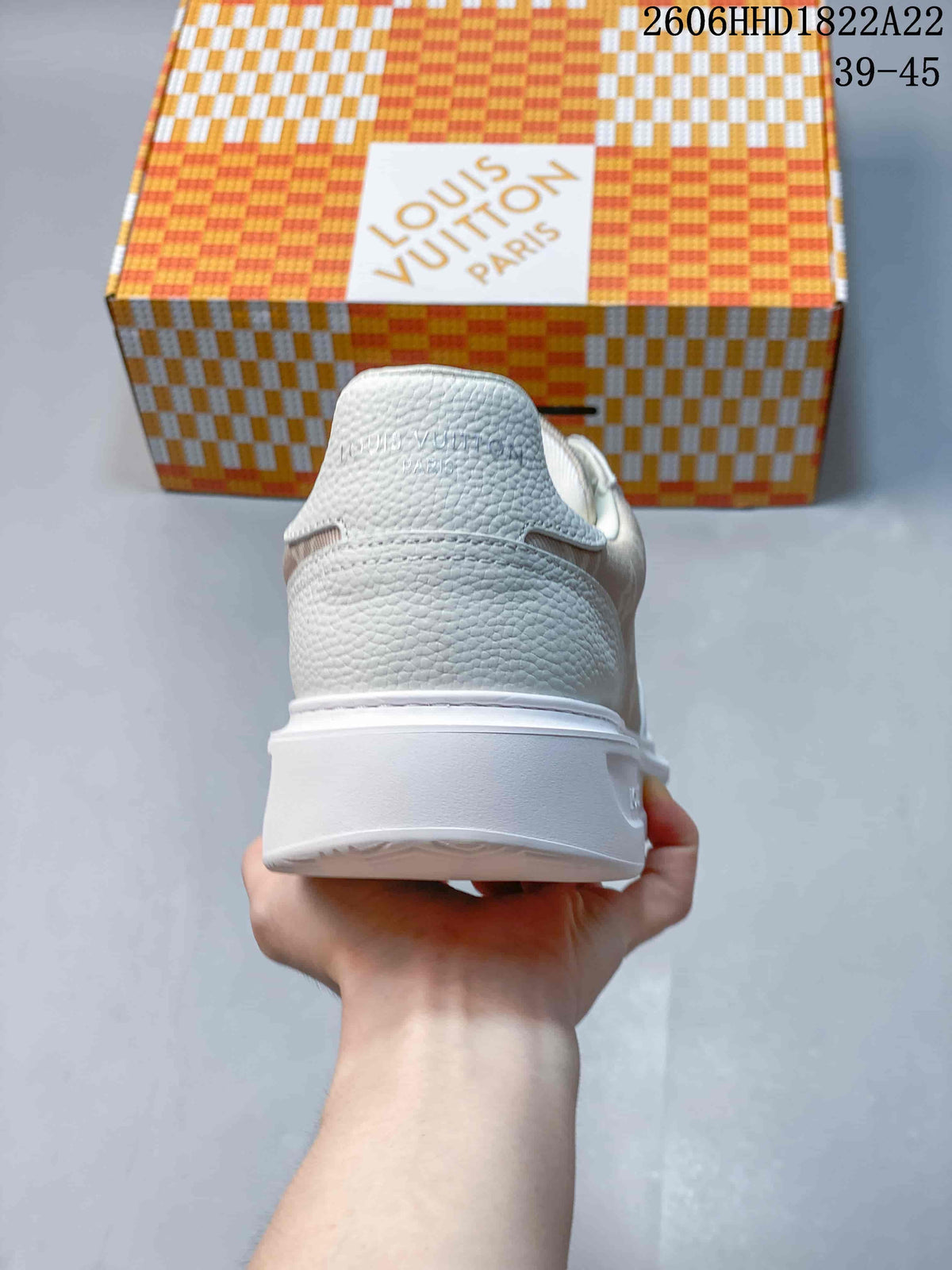 Rear view of the sneaker showing the heel and thick white sole