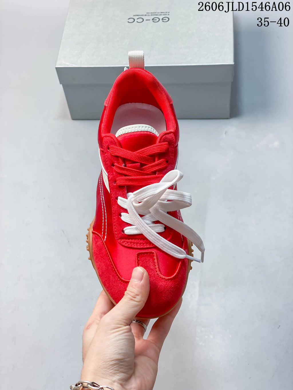 Top view of the red sneaker with contrasting laces and a low-profile shape.