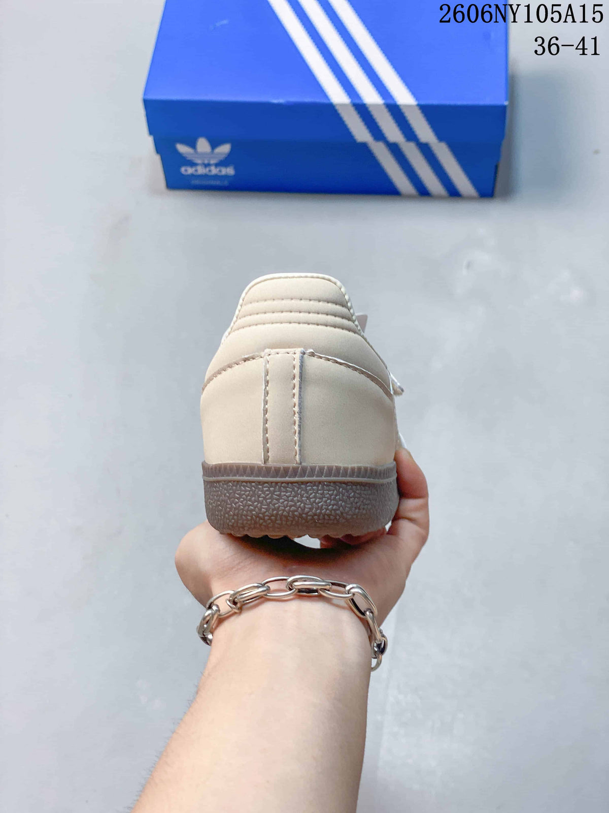 Rear view of a beige Samba Jane sneaker with a gum-colored outsole.