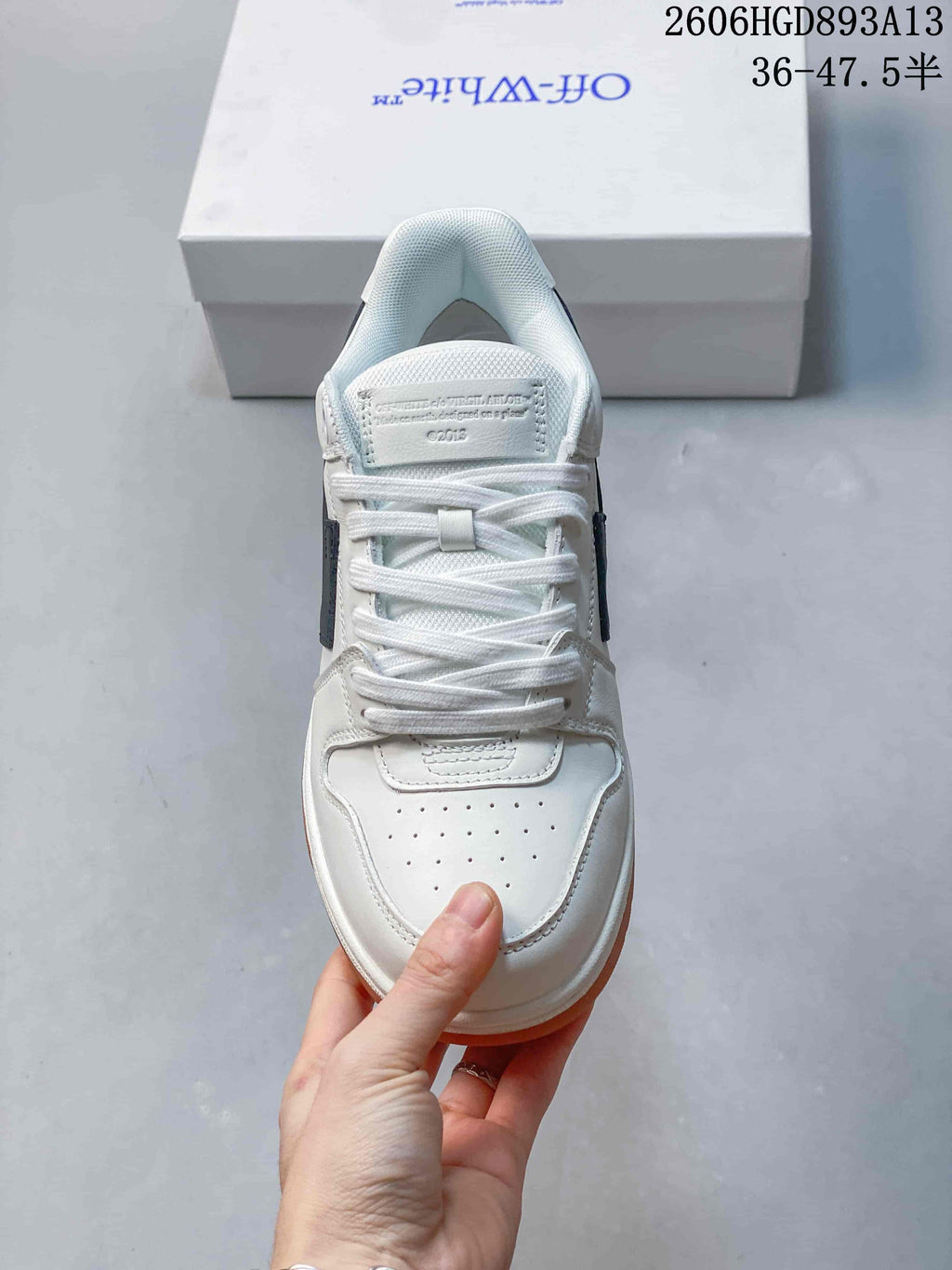 Top view of the lace-up sneakers, showing the perforated toe and tongue.