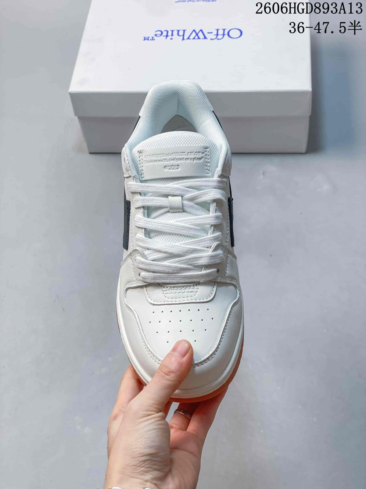 Top view of the lace-up sneakers, showing the perforated toe and tongue.