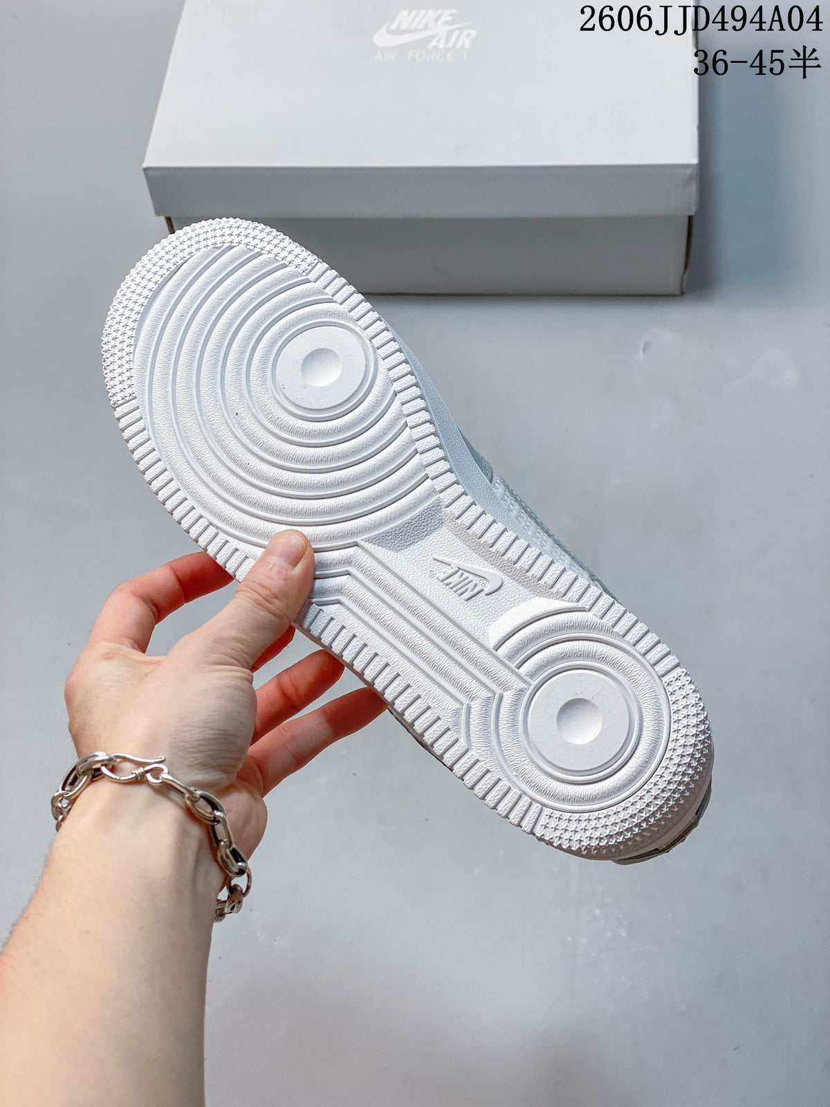 Underside of the white outsole showing the circular tread pattern