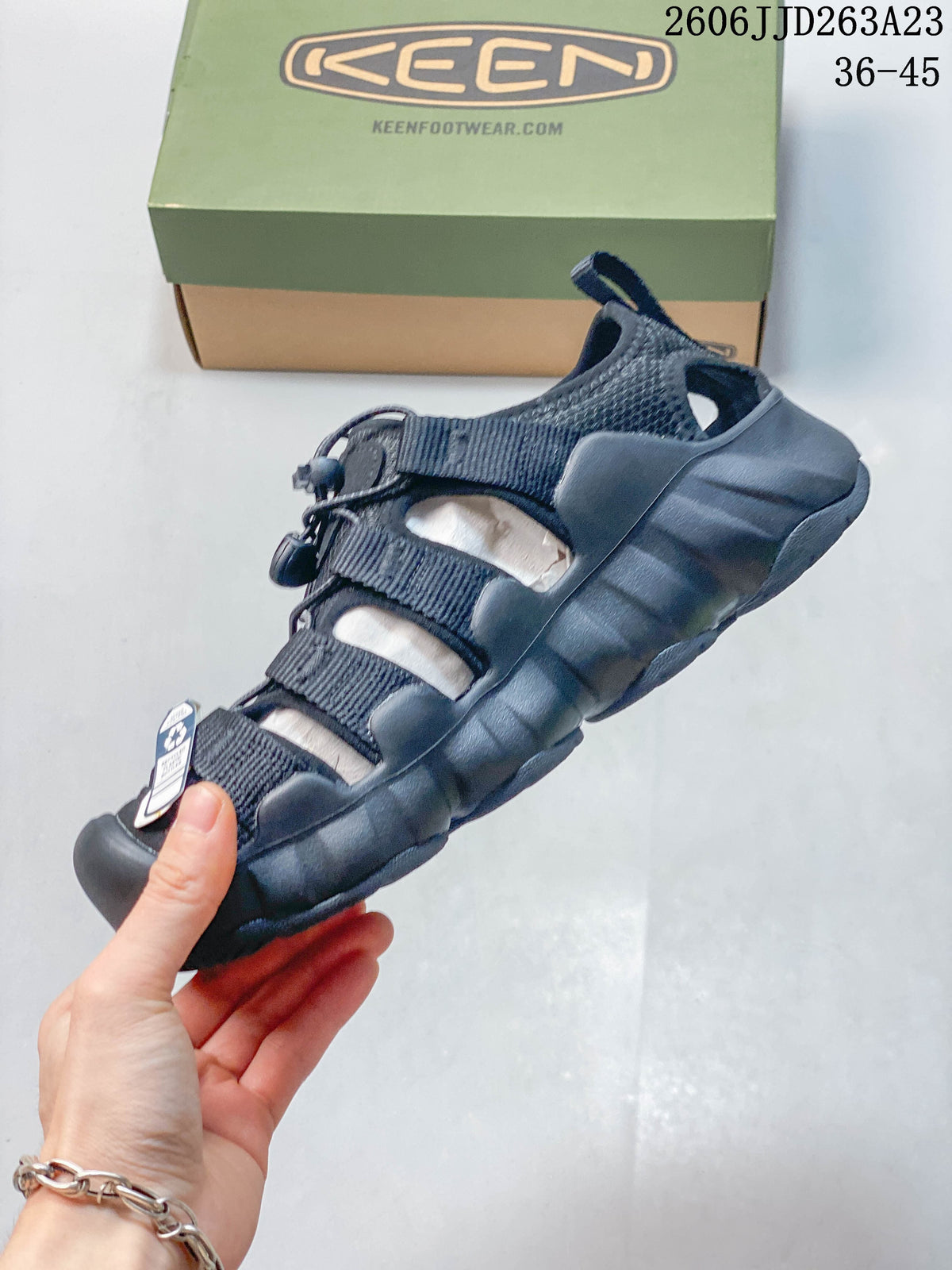 Side profile of the closed-toe sandal with bungee lacing