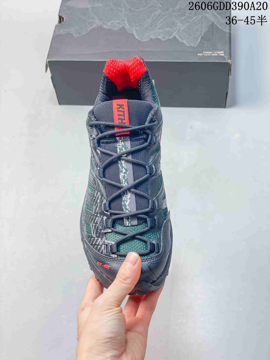 Top view of a Salomon XT-4K shoe showing its lacing and red tongue and heel accents.