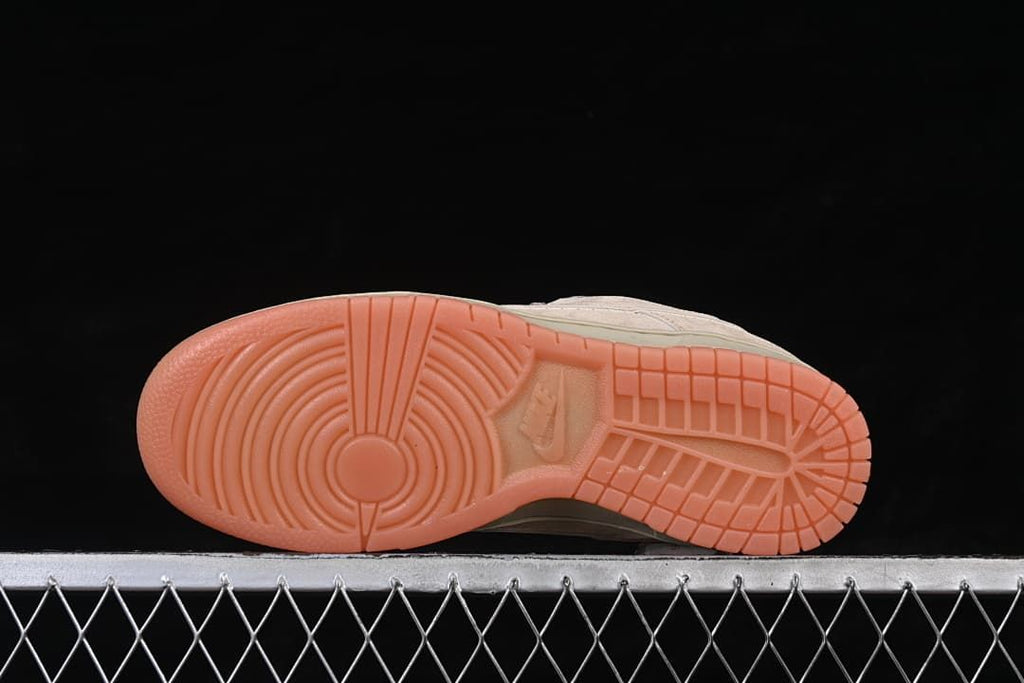 Underside view showing the gum-colored tread