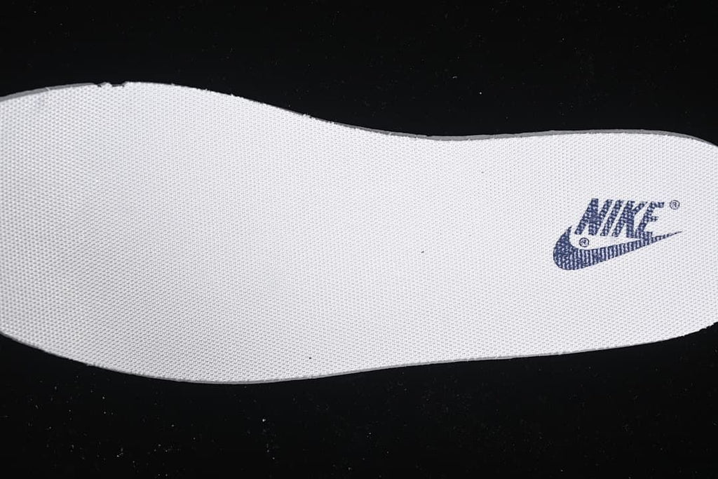 Close-up of a white insole with a Nike logo