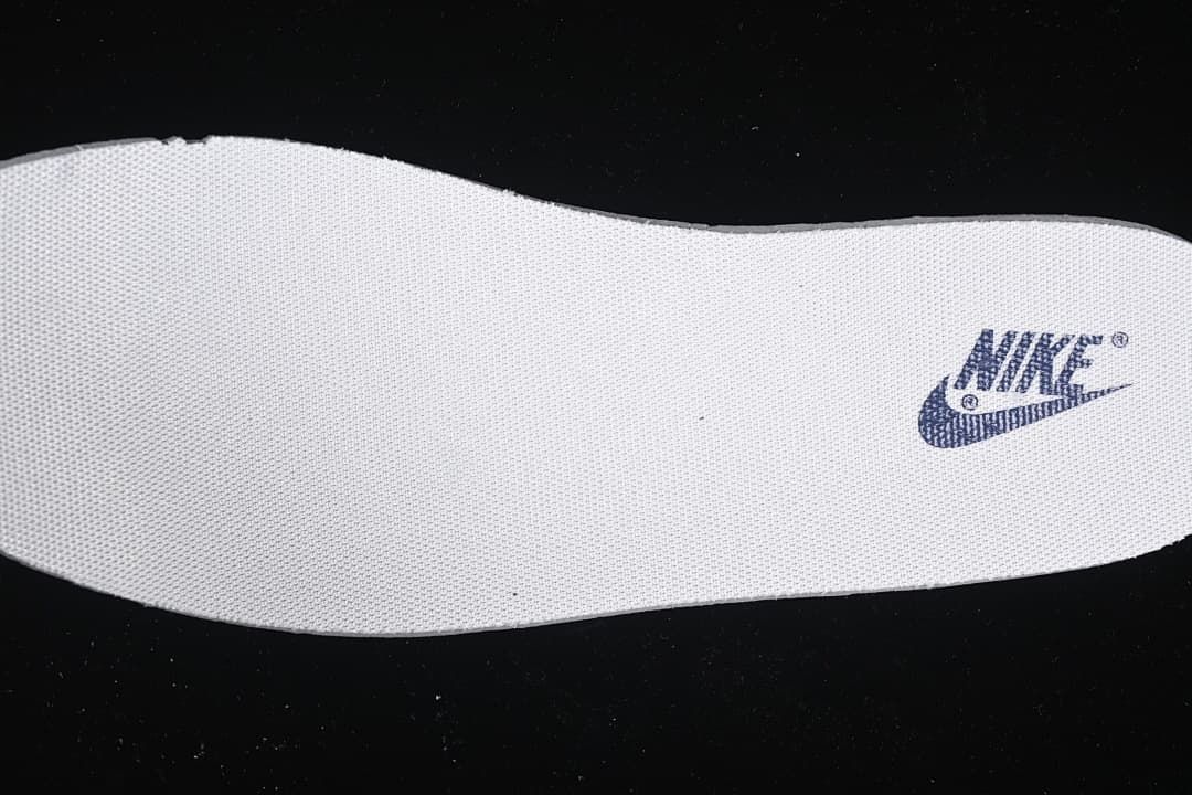 Close-up of a white insole with a Nike logo