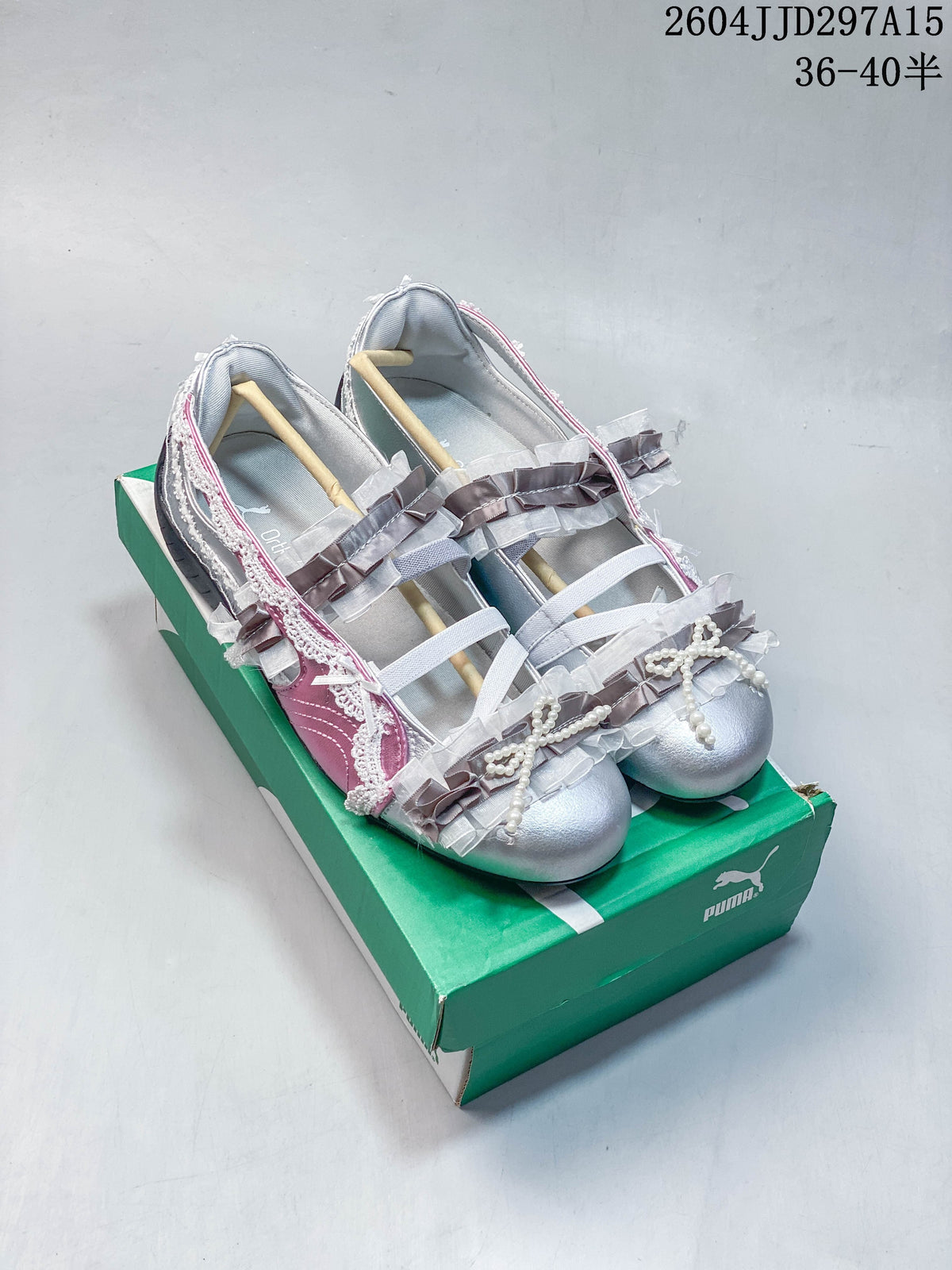 Silver and pink low-profile sneakers with bows, ruffles, and pearl-like trim