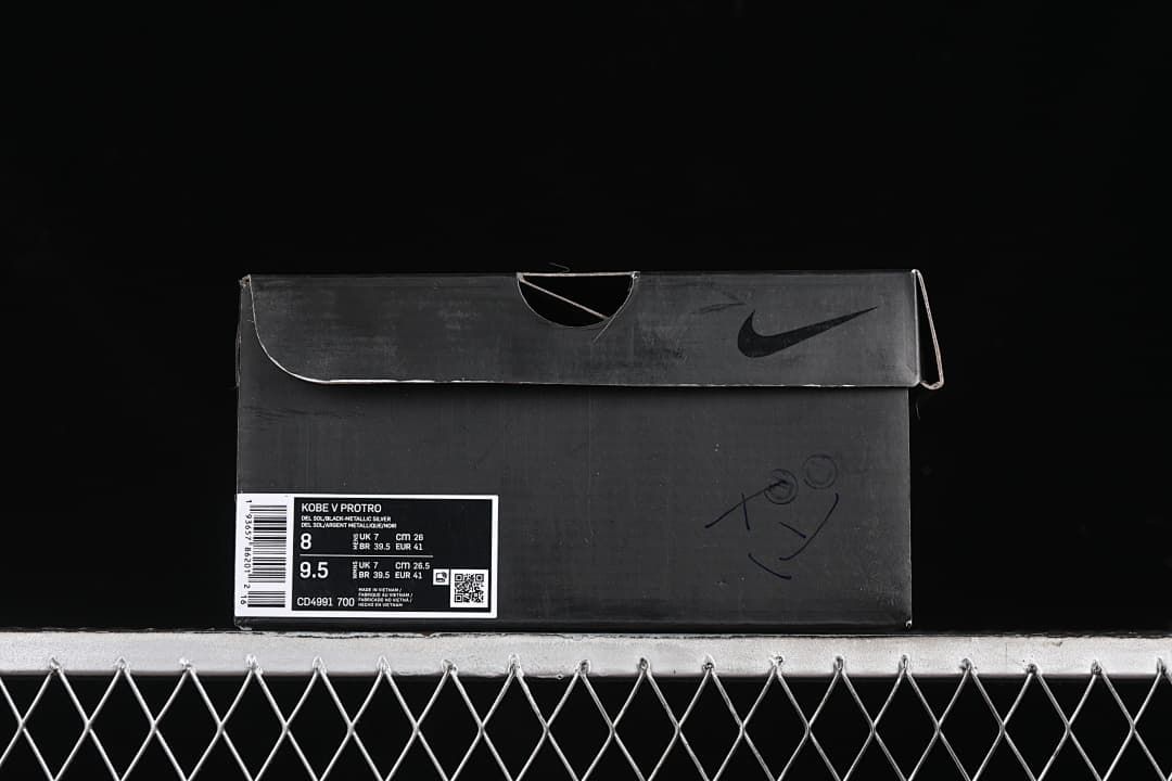 Black shoe box with a visible Kobe V Protro product label