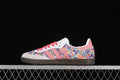 Side view of Samba OG W sneakers with floral-print panels, pink stripes and laces, and a dark brown sole